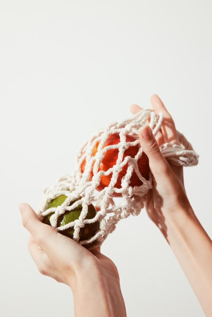 contact hands holding embroidered fabric